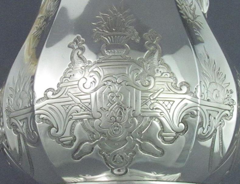 detail of Baroque style decoration from antique French silver coffee pot
