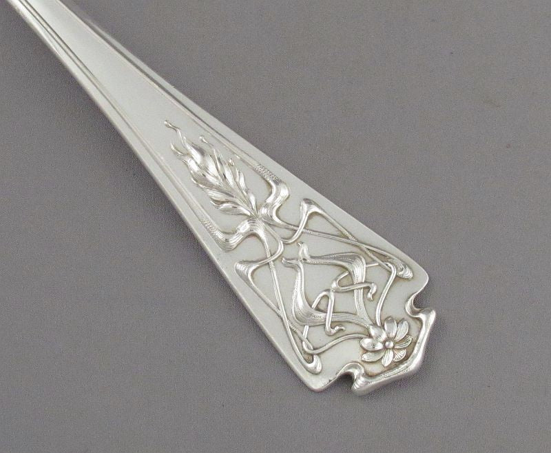 art nouveau silver handle close up detail