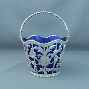 victorian silver sugar basket with pierced sides and blue liner